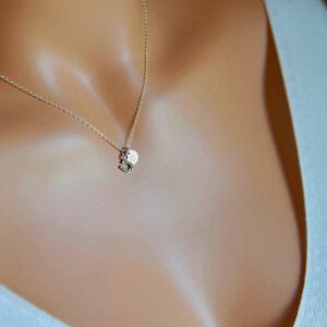 tiny little sterling silver horseshoe necklace. your choice of a silver or gold chain. optional initial disc