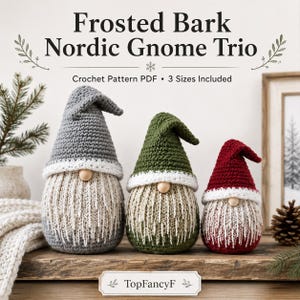 May include: Three crocheted gnomes with tall pointed hats in grey, green, and red, featuring white brims, round wooden noses, and textured beige beards. Text reads: Frosted Bark Nordic Gnome Trio, Crochet Pattern PDF, 3 Sizes Included, TopFancyF.