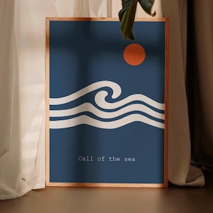 May include: A framed art print featuring a minimalist design. The artwork depicts white stylized waves under an orange sun against a dark blue background. The text "Call of the sea" is at the bottom.