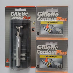 May include: A silver Gillette Contour Plus razor and two packages of replacement blades. The packages are orange, black, and white, with the Gillette Contour Plus logo and the word "Lubrastrip". One package contains the razor, and the other two contain five blades each.