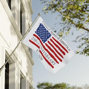 May include: A white flag with the American flag design, including red stripes and a blue field of stars. The flag also features the text "United States of America" and "250th Anniversary 1776-2026."