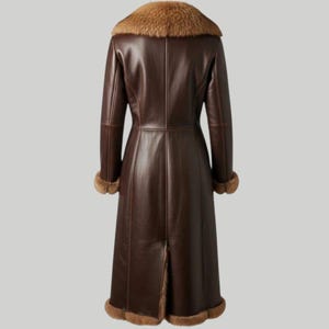 May include: A long, dark brown leather coat with a fur collar and cuffs. The coat has a classic design, reaching to the ankles, and is viewed from the back. The fur trim is a lighter brown color, adding a touch of luxury to the outerwear.