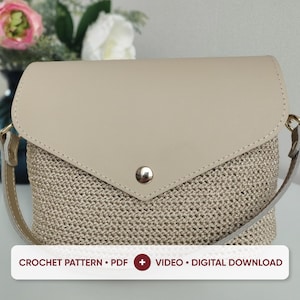 May include: A beige crochet handbag featuring a smooth, solid-colored flap with a silver-tone metal snap closure and a matching shoulder strap. The text on the image reads: CROCHET PATTERN • PDF + VIDEO • DIGITAL DOWNLOAD.