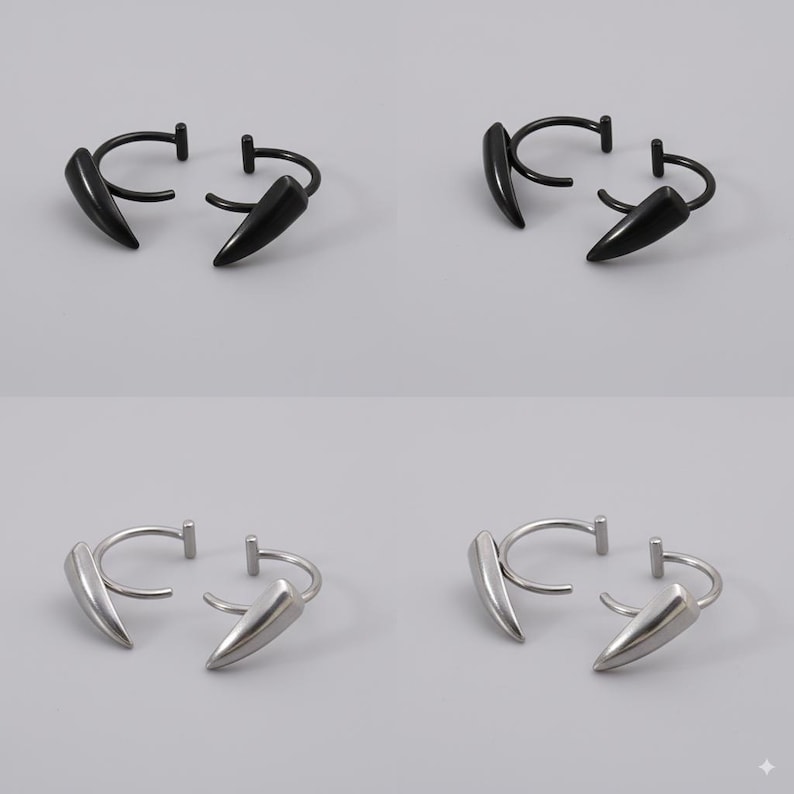 May include: Four pairs of earrings, each featuring a curved hoop design with a pointed, fang-like charm. Two pairs are black, and two are silver, all set against a neutral gray background.