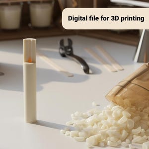 May include: A cream-coloured candle with an orange flame is the focal point of this image. The text "Digital file for 3D printing" is displayed on a light-coloured banner. Other items include candle-making tools and wax flakes.