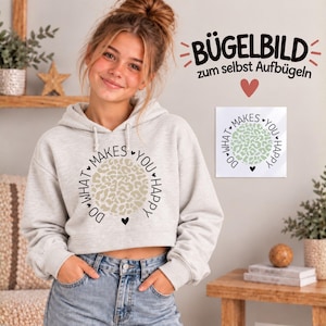 Könnte beinhalten: Ein hellgrauer, bauchfreier Kapuzenpullover mit einem kreisförmigen Grafikdruck, der in der Mitte ein beiges Leopardenmuster zeigt, umgeben von dem schwarzen Text "DO WHAT MAKES YOU HAPPY" und kleinen Herzen. Ein passendes Bügelbild ist ebenfalls zu sehen.
