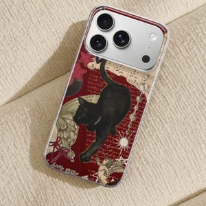 May include: Clear phone case with a red background featuring a black cat, angel, butterfly wing, musical notes, and the words "love you". The case has a clear border and a silver camera housing.