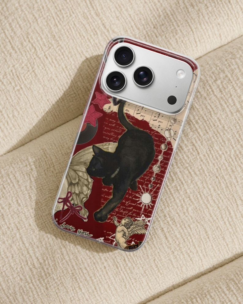 May include: Clear phone case with a red background featuring a black cat, angel, butterfly wing, musical notes, and the words "love you". The case has a clear border and a silver camera housing.