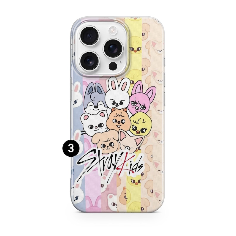 May include: A phone case featuring a colorful design with cartoon animal faces and the text "Stray Kids" in a stylized font. The case has a clear border and a multi-colored background.