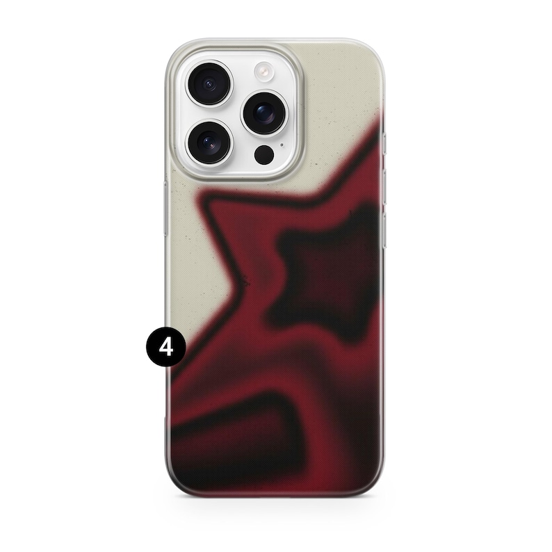 May include: A clear phone case with a cream-colored background and a large, blurred red star design. The star has black shading, and the case has a black number 4 in the lower left corner.