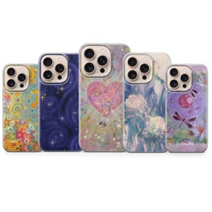 May include: A collection of five phone cases with unique designs. The cases feature various artistic patterns, including a starry night, a heart, floral motifs, and a dragonfly. Each case has a clear border and a camera cutout.