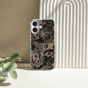 May include: A clear phone case with a black and white collage design. The collage includes various images and the words "SHOW DEEP YOUR LOVE". The case is on a white surface with a beige background and a white arched decorative piece.