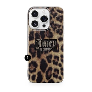 May include: A phone case with a leopard print design. The case features the text "Juicy Couture" in a black rectangle with a rhinestone-like effect. The case is designed to fit a smartphone with multiple camera lenses.