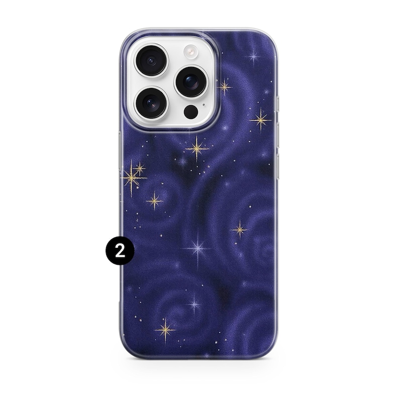 May include: A phone case with a dark blue swirling galaxy design. The case features gold star accents and a clear border. The number "2" is printed in white on the lower left corner of the case.