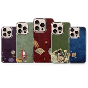 May include: Five smartphone cases featuring mystical designs. The purple case shows a crystal ball and candle. The green case depicts a figure in red robes. The red case shows hands and tarot cards. The olive case features The Empress card. The blue case shows stars.