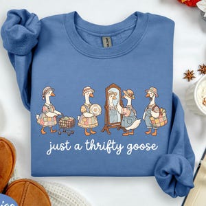 May include: A set of three ceramic mugs with a speckled, matte finish. The mugs are in shades of cream, light gray, and dark gray. Each mug has a simple, minimalist design, perfect for coffee or tea.