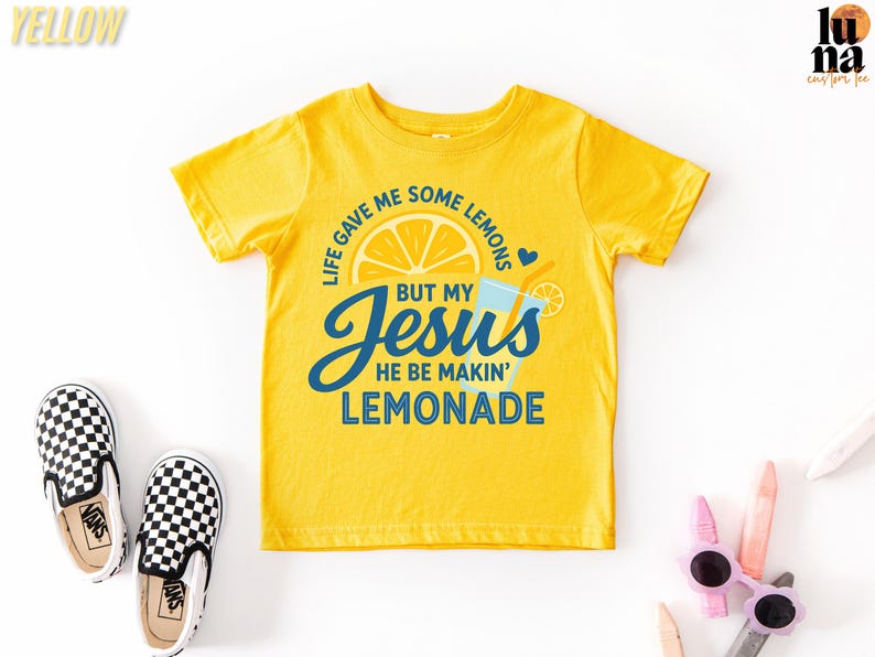a yellow t-shirt with a humorous text and graphic design, along with a pair of black and white checkered shoes and some children's sunglasses.