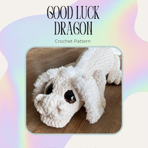 May include: A crochet pattern document titled Good Luck Dragon by Entwined Earth Fibre Arts. The cover features a cream-colored, plush, textured dragon toy with large dark eyes. The PDF includes instructions by Keara Brown for this soft creature.