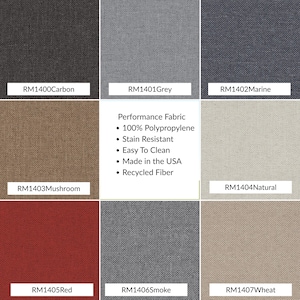 Washable performance fabric swatches in neutral tones styled on a wooden bench sea