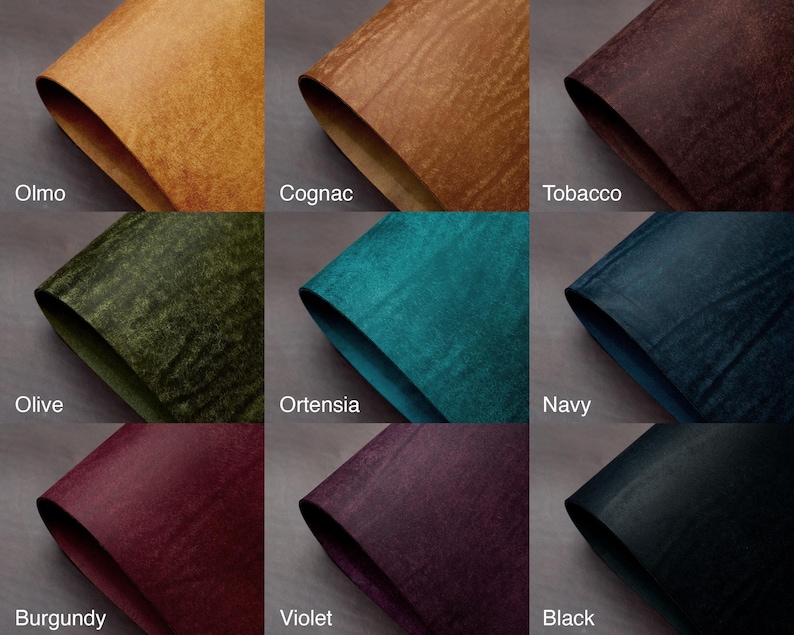 May include: Nine swatches of textured leather in various colors. Colors include Olmo, Cognac, Tobacco, Olive, Ortensia, Navy, Burgundy, Violet, and Black. Each swatch is folded to show the material's texture and color variations.