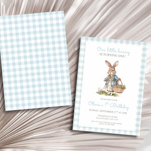 May include: A light blue and white gingham patterned invitation and matching card. The invitation features a watercolor illustration of a bunny holding a basket, with text that reads "Our little bunny is turning one!" and party details.
