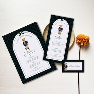 May include: Baby shower stationery set featuring a teddy bear illustration. The set includes a menu, place card, and a larger card, all with a green and navy plaid pattern and a white border. The menu includes the text "Jennie's Baby Shower".