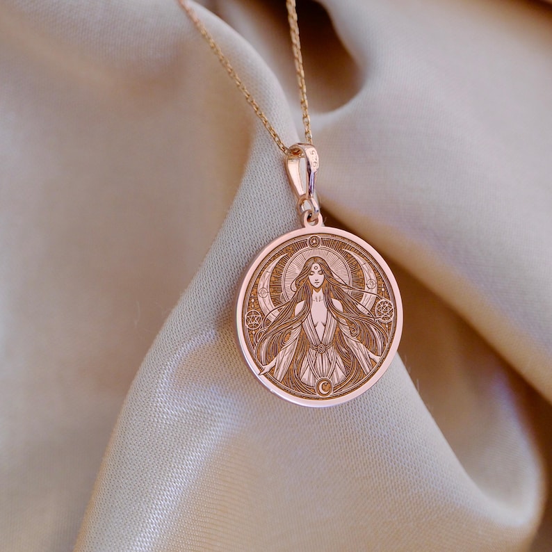 Lilith necklace in gold featuring detailed sacred feminine symbol pendant on chain occult jewelry