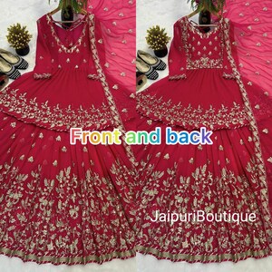 May include: A vibrant red dress with intricate gold embroidery, featuring a V-neckline and long sleeves. The dress has a layered skirt and is paired with a matching sheer scarf. The text "Front and back" is visible.