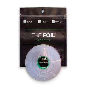 May include: A silver foil cassette with a green core is displayed in front of a black package. The package has the text "THE FOIL CASSETTE" and labels for black, silver, and copper.