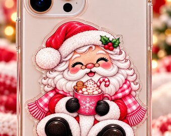 May include: A clear smartphone case featuring a sticker of a cheerful Santa Claus with a white beard, wearing a red hat and scarf, holding a pink mug filled with whipped cream, a candy cane, and a small gingerbread man cookie.