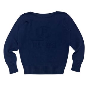 May include: Navy blue sweater with ribbed cuffs and hem. The sweater features an embossed design with the letters "P" and "RL-92". The long-sleeved sweater is made of a soft knit material.