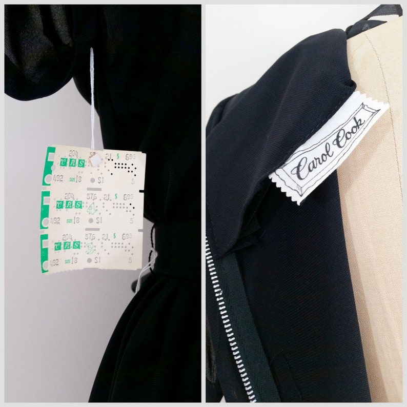 May include: Black dress with a zipper and a white tag that says "Carol Cook".