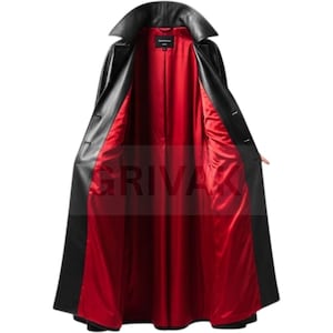 May include: A long black leather coat with a wide collar and button closure. The interior lining is a vibrant red. The coat is open, revealing the red lining and the word "GRIVAK" in the center.