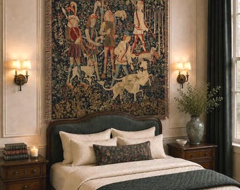 May include: A large rectangular wall tapestry featuring a dark-toned medieval hunting scene with figures and hounds, suspended from a black metal rod. The tapestry displays intricate woven details in shades of green, red, and gold.
