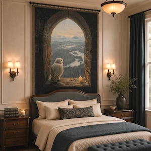 May include: A large rectangular wall tapestry featuring a snowy owl perched on a stone ledge within a gothic archway, overlooking a winding river and mountain landscape at dusk, with a single lit candle placed beside the owl on the ledge.