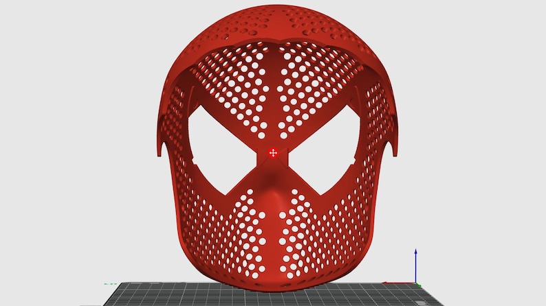 May include: A red, 3D-printed mask with a distinctive design featuring large eye openings and a perforated surface. The mask's shape is reminiscent of a superhero's mask, with a smooth, curved top and a defined facial structure.