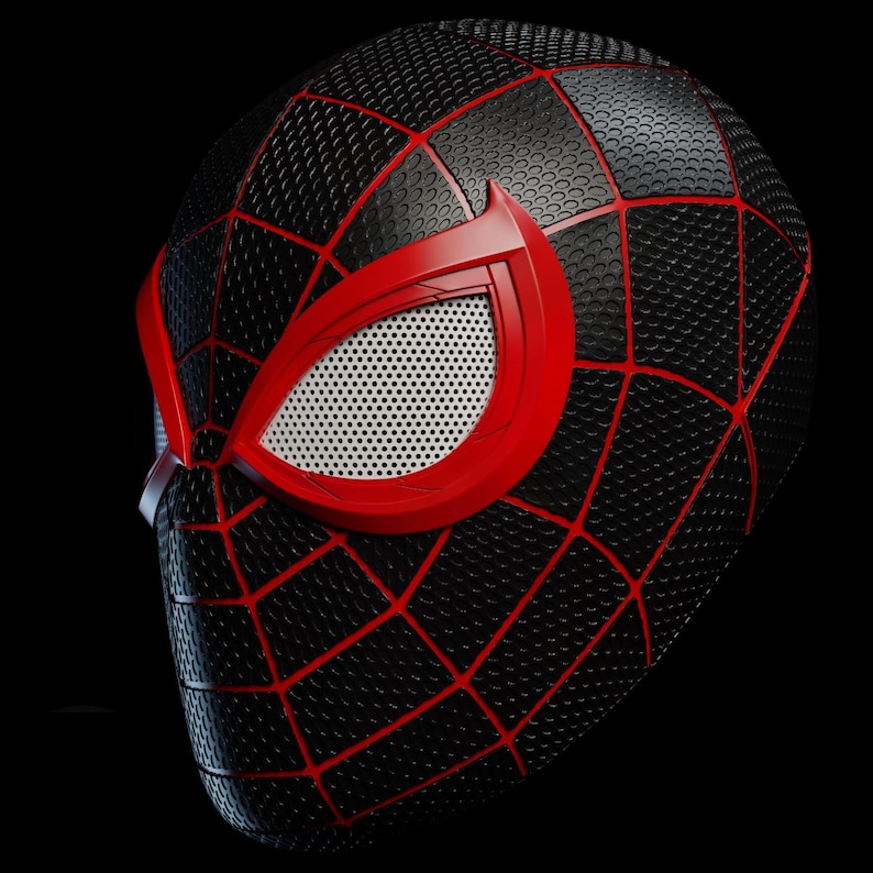 May include: Black and red Spider-Man mask with a textured surface and a web pattern. The mask features red eye frames with white mesh eye coverings. The mask is set against a black background.