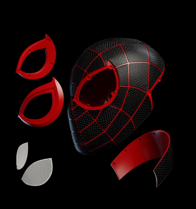May include: A black and red Spider-Man mask with separate red eye pieces and a lower jaw component. The mask features a textured surface with a web pattern in red. The eye pieces are red and the eye lenses are white with small holes.