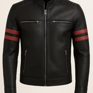 May include: Black leather jacket with a stand-up collar, a zip-up front, and two red stripes on each sleeve. The jacket has two zippered chest pockets and two lower zippered pockets. The shoulders have quilted detailing.