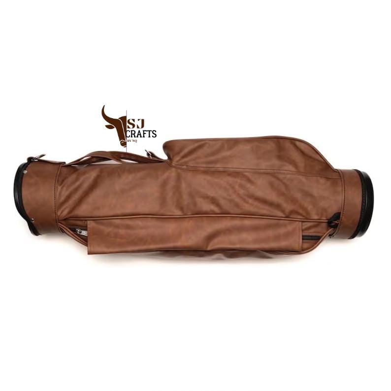 May include: A brown leather golf bag with black accents. The bag has a zippered pocket and a handle for carrying. The bag has the text "SJ Crafts" and a logo.