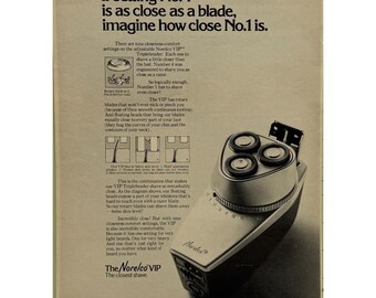 Anuncio impreso de 1972 de la afeitadora eléctrica vintage Norelco VIP Tripleheader con cabezales flotantes.