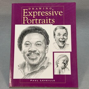 May include: A hardcover book titled "Drawing Expressive Portraits" with a purple cover. The cover features pencil sketches of three people with expressive faces. The author's name, Paul Leveille, is printed at the bottom.