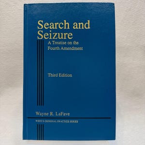 May include: A blue book titled "Search and Seizure" with gold lettering. The book's cover includes the text "A Treatise on the Fourth Amendment" and "Third Edition." The author's name, Wayne R. LaFave, is also visible.