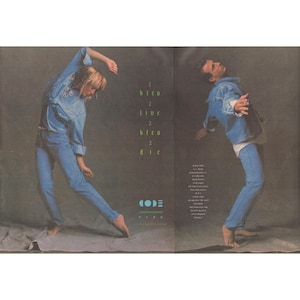 May include: An advertisement featuring two people wearing denim jackets and jeans. The text "2 bleu 2 live 2 bleu 2 die" is vertically stacked on the left side. The brand name "CODE BLEU" is also visible.