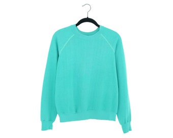bright turquoise sweater