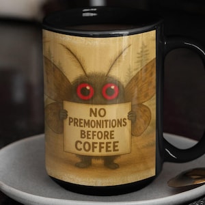 Mothman Coffee Mug – No Premonitions Before Coffee | Cute Cryptid Cup for Paranormal Fans | 15oz Appalachian Folklore Gift