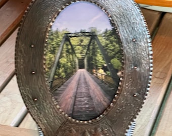 Oval copper picture frame for 6"x4" photos, hammered and chased design of acorns and leaves, medium bronze patina