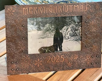 Christmas memory picture frame with etched and patinated snowflake design.