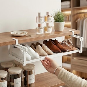 May include: A set of three ceramic mugs with a speckled, matte finish. The mugs are in shades of cream, light gray, and dark gray. Each mug has a simple, minimalist design and a rounded handle.