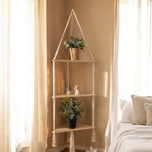 May include: A white ceramic mug with a black handle and the text "But First, Coffee" in a black, handwritten-style font. The mug is on a white surface.